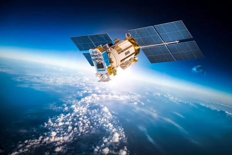 Vector image of a solar powered satelite space craft with space and the earth in the background.