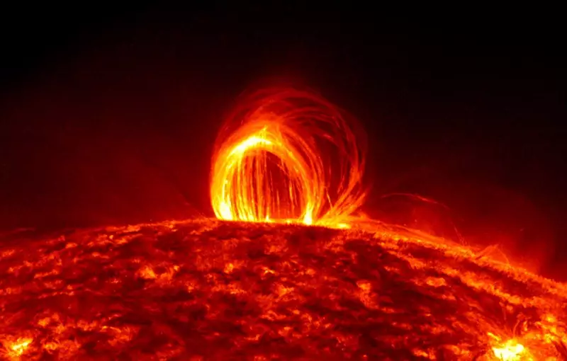 Color photo of a Loop-Type Coronal Mass Ejections (LCME) on the sun with a black space background.