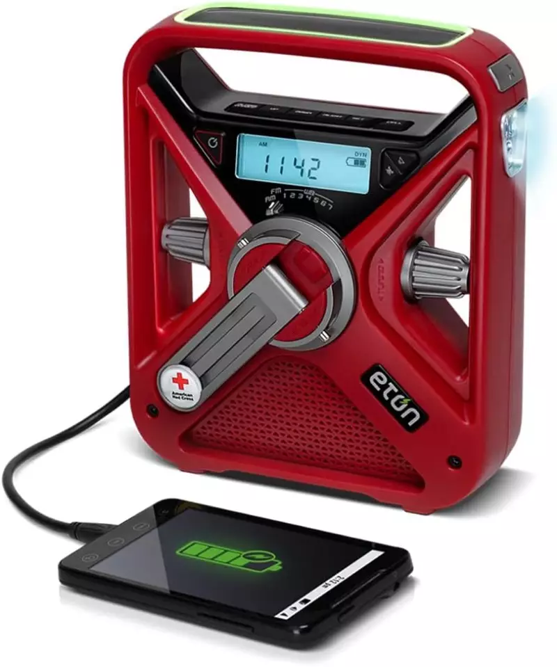 Color photo of the Eton American Red Cross FRX3+ Emergency NOAA Weather Radio on a white background.